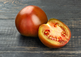 Fototapeta na wymiar Tomato kumato with half