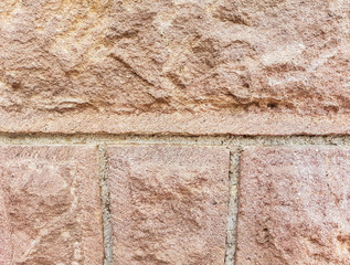 Carved stone on residentual house foundation close up shot on natural light.