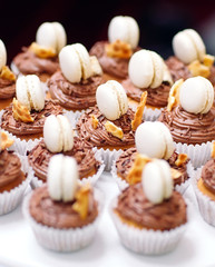 Homemade cupcakes with macaroons.