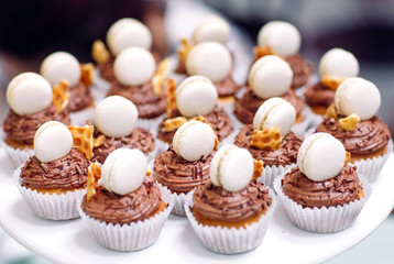 Homemade cupcakes with macaroons.