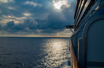 Cruise cancellation - ship sun through clouds