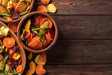 Dried vegetables chips from carrot, beet, parsnip and other vegetables. Organic diet and vegan food.