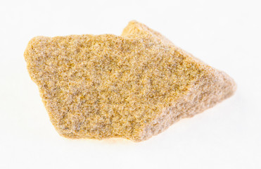 raw yellow sandstone rock on white