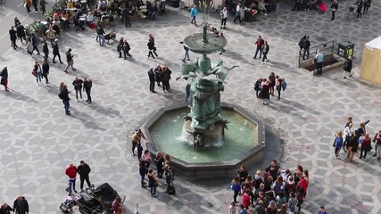 Copenhagen, Denmark - October 6, 2018: People walk around on Stork Fountain Place, Amagertorv, Copenhagen, Denmark