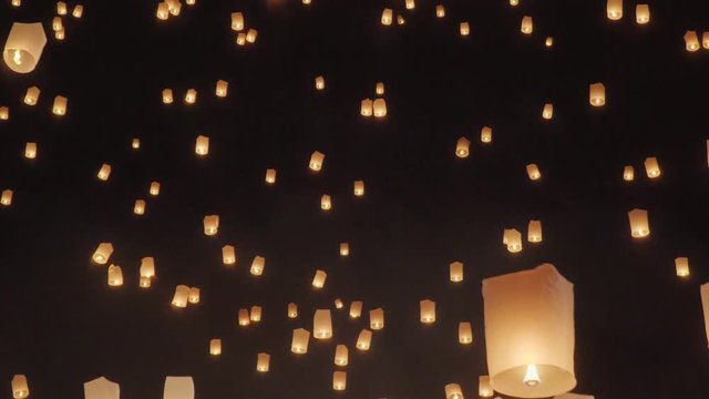 Tourist floating sky lanterns in Loy Krathong festival , Chiang Mai ,Thailand.