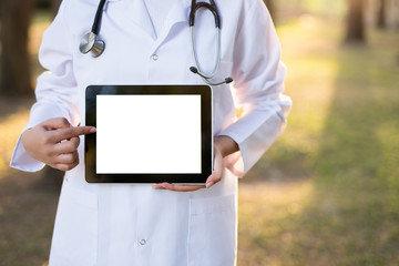 Doctor Using Digital Tablet outdoors
