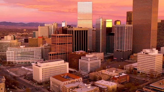 Timelapse - Aerial drone video of Denver Colorado under a fiery sunrise.  