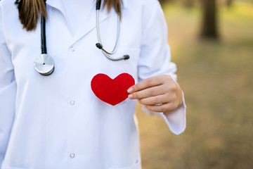 Doctor with a stethoscope holding heart