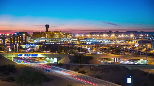 Phoenix Arizona Night Travel Landscape Timelapse with Streaking Lights from Vehicle Traffic Driving Over a Downtown Skyline Background at Dusk