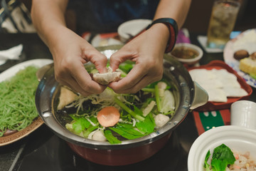  Sport women eats suki yaki after exercise