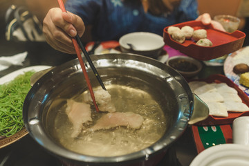  Sport women eats suki yaki after exercise