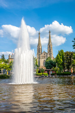 Germany, Bavaria, Bamberg, Augustaplatz and parish church, fountain in the foreground
