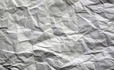 White color crumpled sheet of paper.