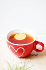 Having a cup of tea in bed - cozy breakfest at home