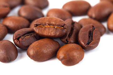 Roasted coffee beans isolated on white background. Three coffee beans