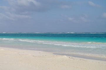 White sand  beach and waves on the coast of the Caribbean Sea, Mexico. Riviera Maya