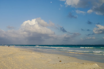 Fototapeta na wymiar White sand beach and waves on the coast of the Caribbean Sea, Mexico. Riviera Maya