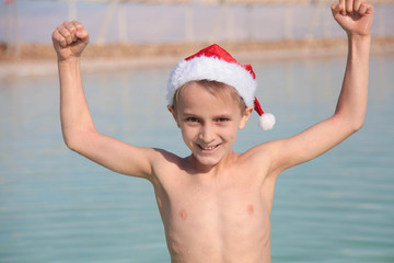 Obraz premium Happy little Santa at the Dead Sea