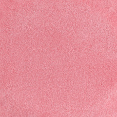 Red sponge texture background, close up view of a cosmetic sponge or pad for facial make up