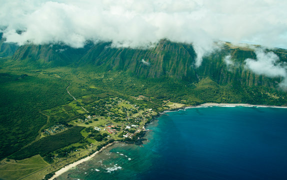 Beautiful Aerial Scenic View Photo of Molokai Sea Cliffs From The Air with Deep Blue Ocean Water Below in Tropical Island Paradise in Hawaii