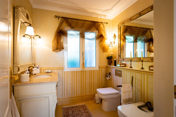 The dining room in classical style, light furniture, marble, luxury.