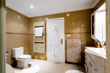 The dining room in classical style, light furniture, marble, luxury.