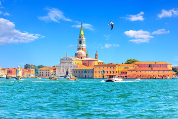 View on Guidecca island with its Church and boats, Venice, Italy