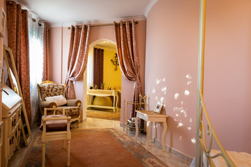 The dining room in classical style, light furniture, marble, luxury.