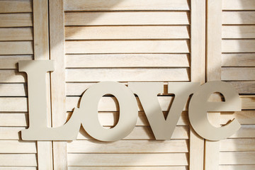 The word love wood decorated.
