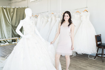 Naklejka premium Woman Shopping For Expensive Wedding Attire
