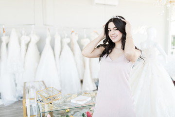 Woman Buying Jeweled Headdress In Bridal Store