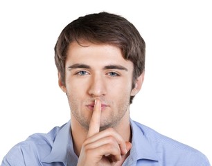 Young Man with Finger on Lips