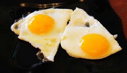 Roasted eggs on the black plate and dill over