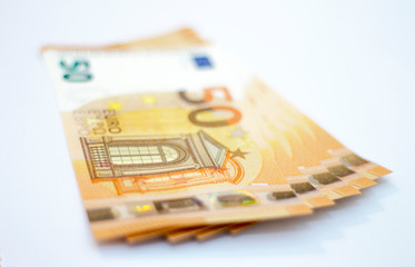 Fifty euro banknotes spread out isolated on white