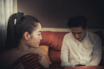 Beautiful asian woman sad after sex,she has sex with boyfriend but he not love her,he playing smartphone All the time.