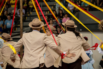 Gaucho dancers performing on their backs.