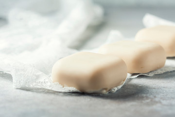 Bars with handmade soap with coconut, concept of spa and health.