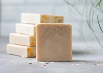Handmade soap bars with oatmeal flakes. Organic soap making. Spa treatments. - obrazy, fototapety, plakaty
