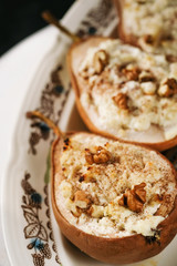 healthy vegan dessert, baked pears with nuts and honey.Selective focus