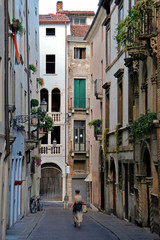 Fototapeta premium Vicenza, Veneto / Italy - August 2008: Narrow street in the old city centre