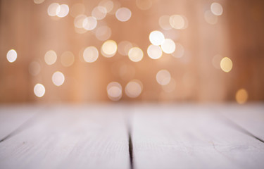 Wood plank and bokeh lights. New year, christmas and celebration background.