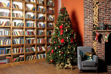 Christmas tree in the room near the fireplace and home library, the Christmas mood with gifts