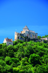 Fototapeta na wymiar A view of the medieval fortress of Castelnaud La Chapelle high above the Dordogne River in Aquitaine, France