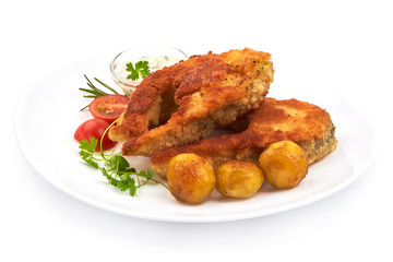 Fried Batterer Fish Fillet with herbs, sauce and potatoes, isolated on a white background. Close-up