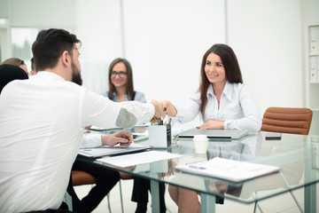 business handshake of business people at the office Desk