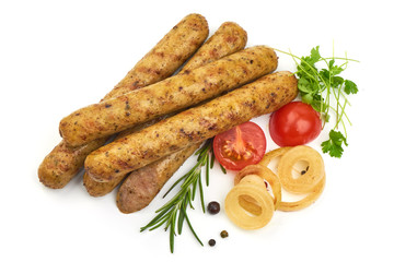 German food. Spicy Sausages with herbs, onion, pepper and tomatoes, isolated on a white background. Close-up.