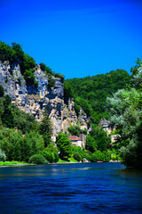 Fototapeta na wymiar A view up the Dordogne River near the medieval village of La Roque Gageac in Aquitaine, France