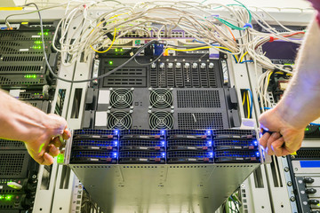 Installation of a modern new database server. Maintenance of computer equipment in the data center. Replacing the server in the switch rack