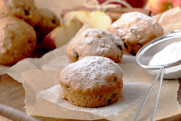 Closeup of a plate of cranberry and nut cookies on a Christmas plate