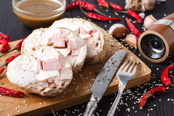 Stuffed roll of chicken with cheese and sage